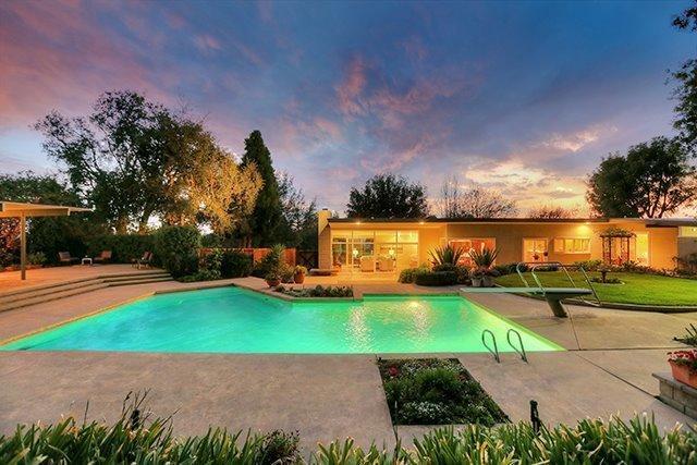 2985 Meyerloa Lane Pasadena, CA 91107 - Photo 22 of 30 a view of a swimming pool with an outdoor space and seating area