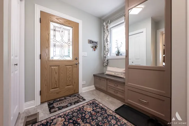a balcony with furniture and potted plant