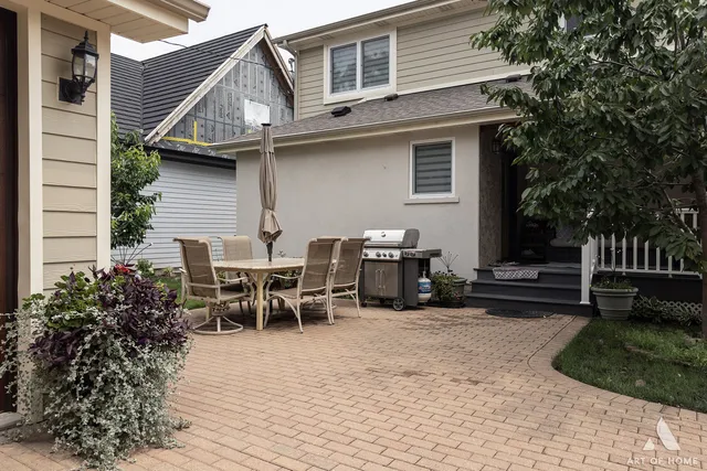 an aerial view of a house with yard
