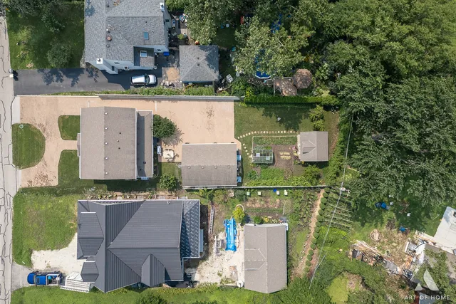 an aerial view of a house with outdoor space pool seating area and yard