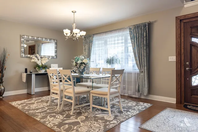 a kitchen with kitchen island granite countertop a sink and refrigerator