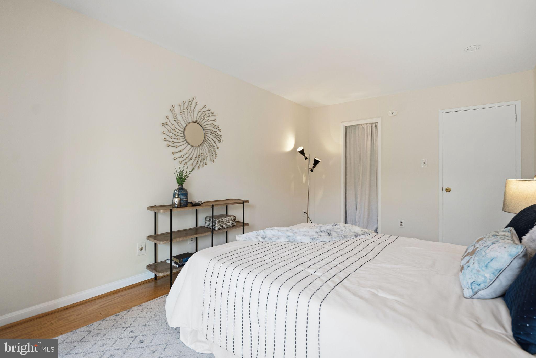 3225 Grace Street Northwest, Unit 226 Washington, DC 20007 - Photo 21 of 45 a bedroom with a bed and a table