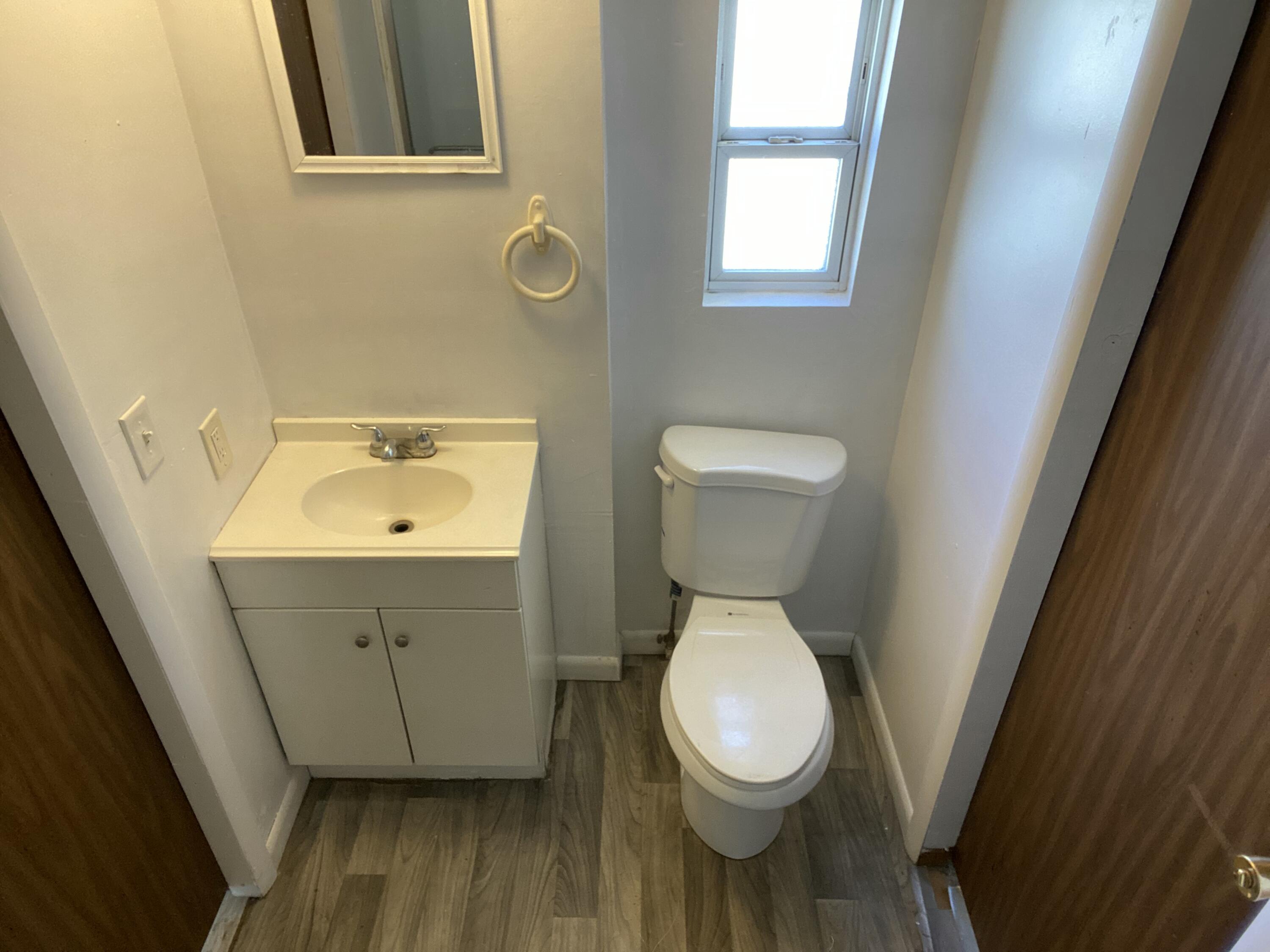 7835 Southeast 60th Drive Okeechobee, FL 34974 - Photo 24 of 35 a bathroom with a sink and a toilet