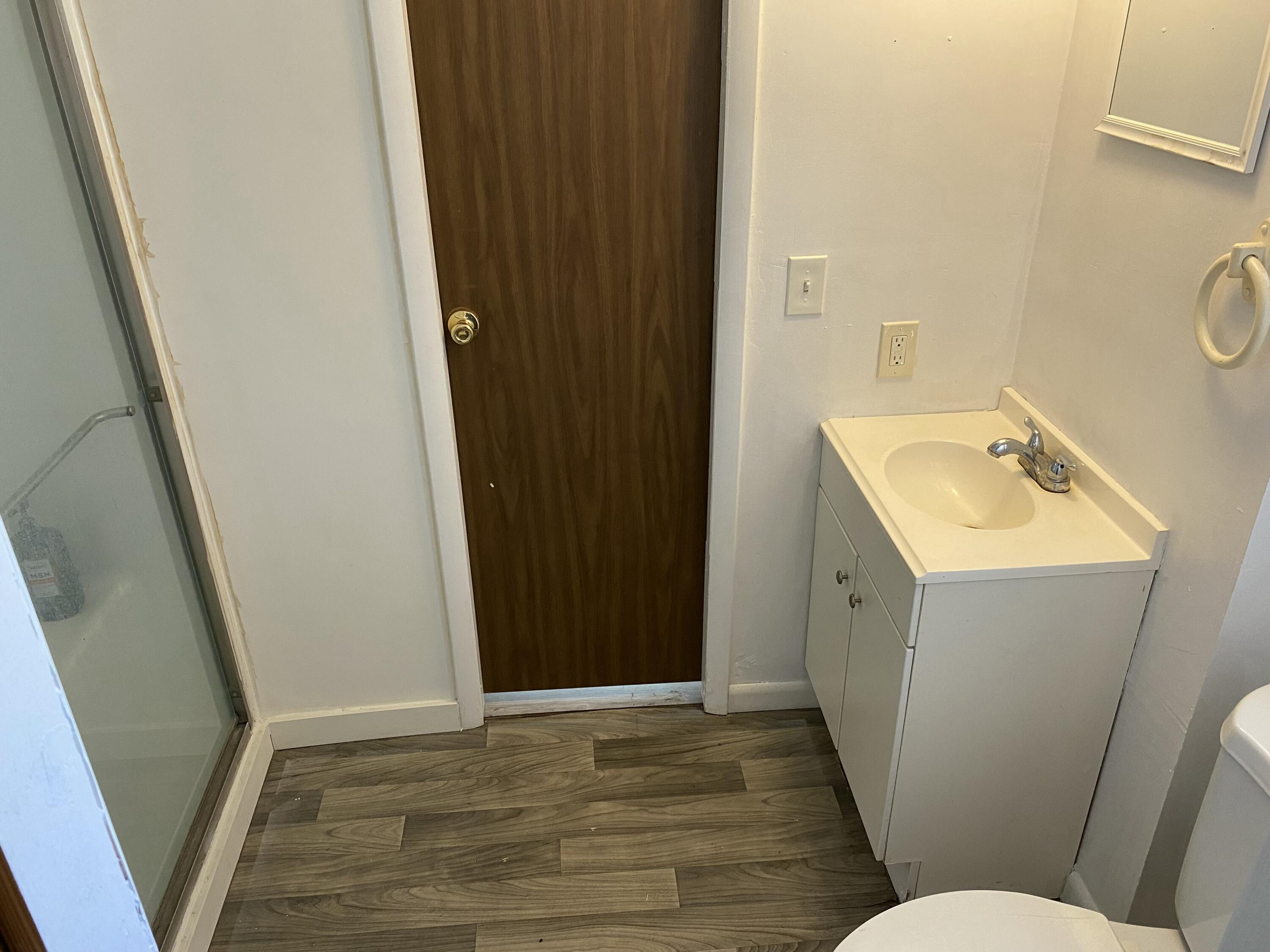 7835 Southeast 60th Drive Okeechobee, FL 34974 - Photo 25 of 35 a bathroom with sink and mirror