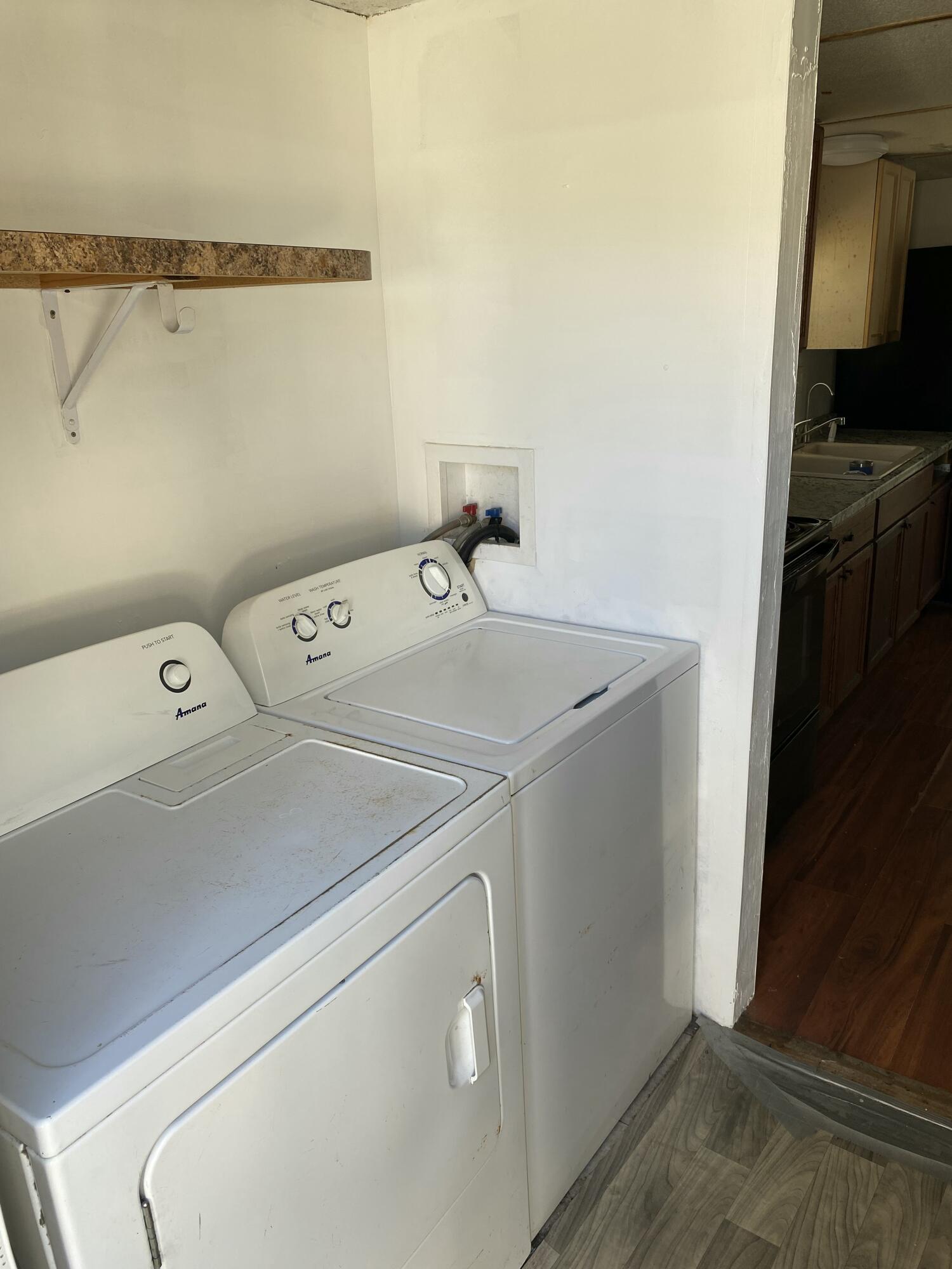 7835 Southeast 60th Drive Okeechobee, FL 34974 - Photo 28 of 35 a utility room with dryer and washer