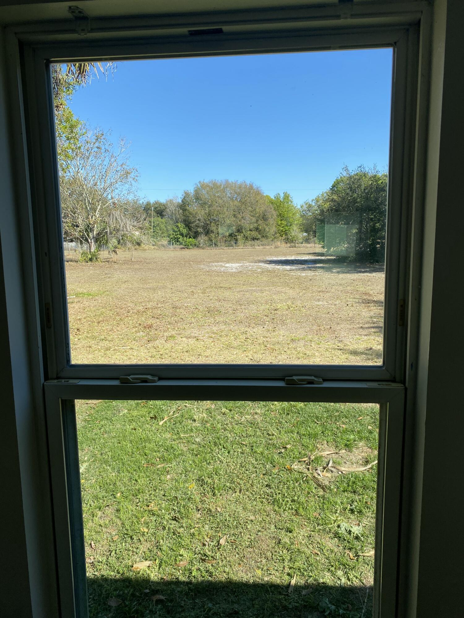 7835 Southeast 60th Drive Okeechobee, FL 34974 - Photo 31 of 35 a view of lake from a window