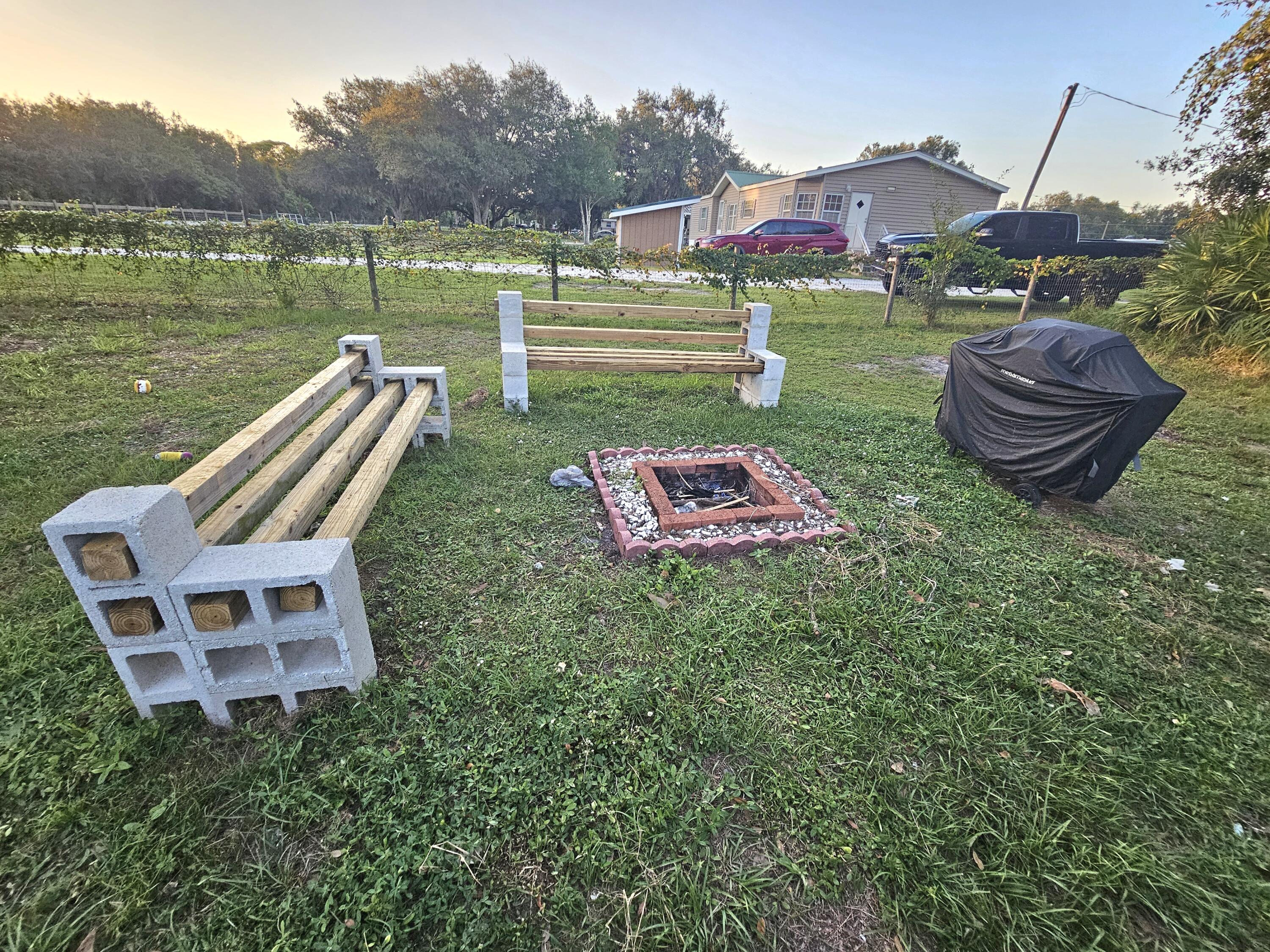7835 Southeast 60th Drive Okeechobee, FL 34974 - Photo 33 of 35 a view of a garden with sitting area