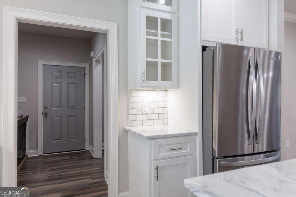 601 Pine Point Circle Valdosta, GA 31602 - Photo 18 of 45 a view of kitchen with wooden floor cabinets and stainless steel appliances