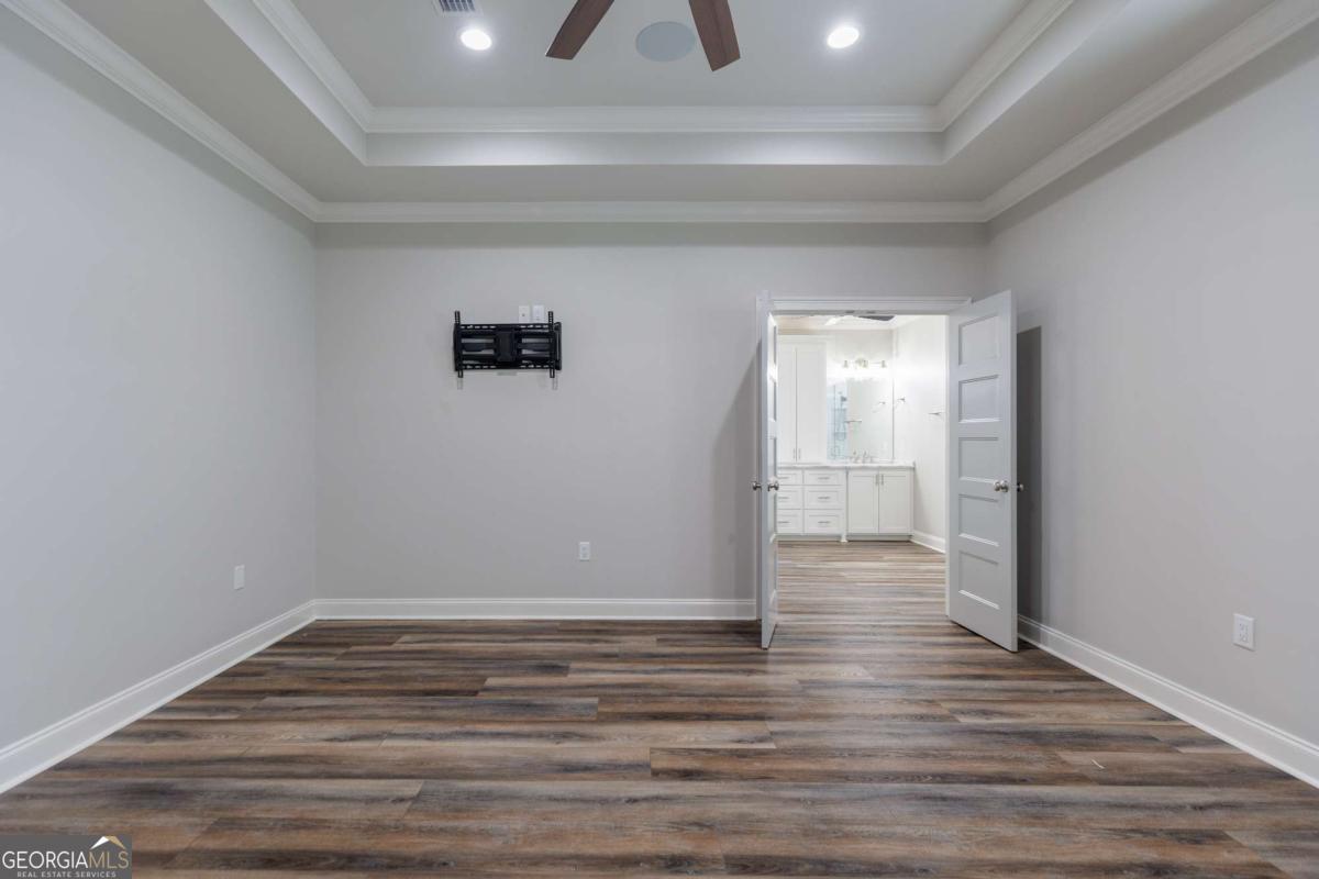 601 Pine Point Circle Valdosta, GA 31602 - Photo 20 of 45 a view of room with wooden floor and window
