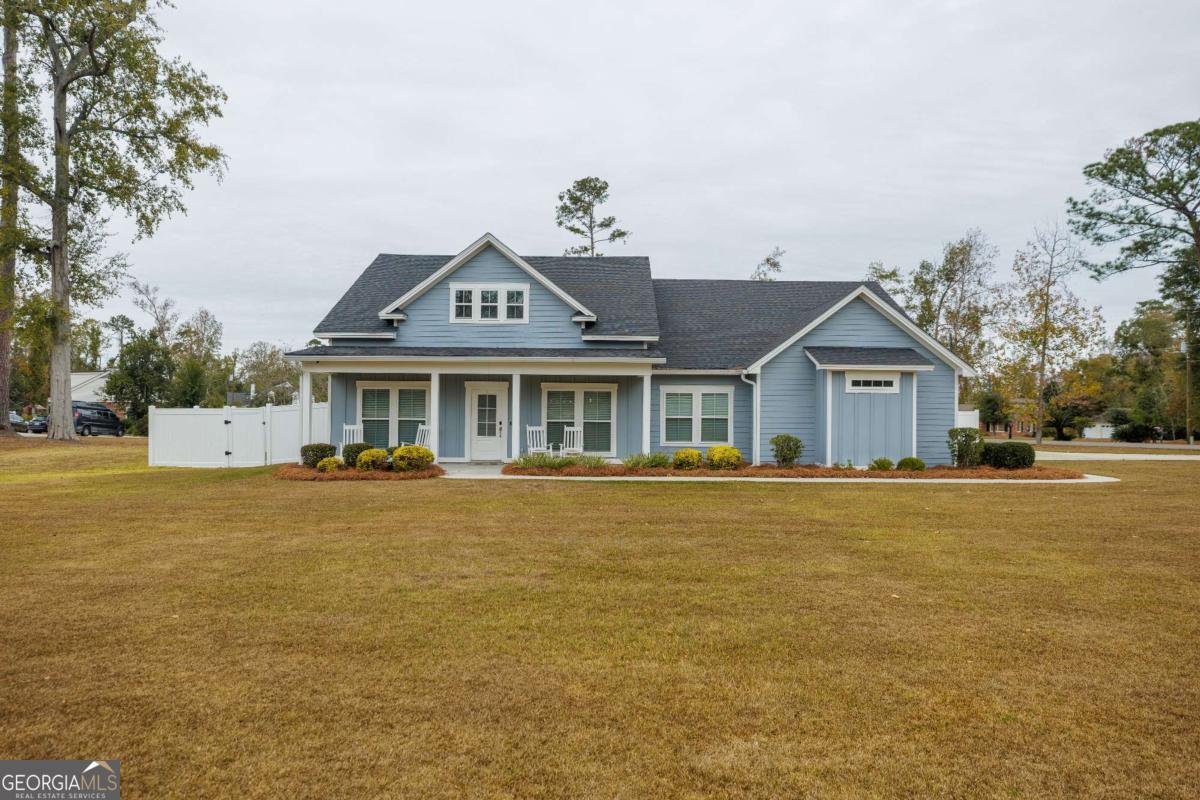601 Pine Point Circle Valdosta, GA 31602 - Photo 2 of 45 a front view of house with yard and swimming pool