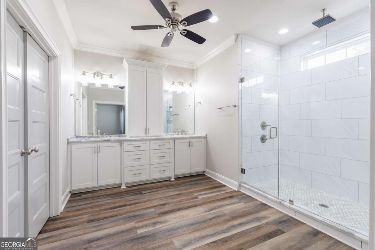 601 Pine Point Circle Valdosta, GA 31602 - Photo 22 of 45 a bathroom with a sink shower and a mirror