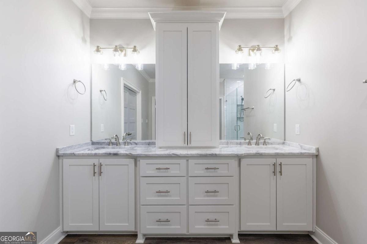 601 Pine Point Circle Valdosta, GA 31602 - Photo 23 of 45 a bathroom with a sink double vanity and a mirror