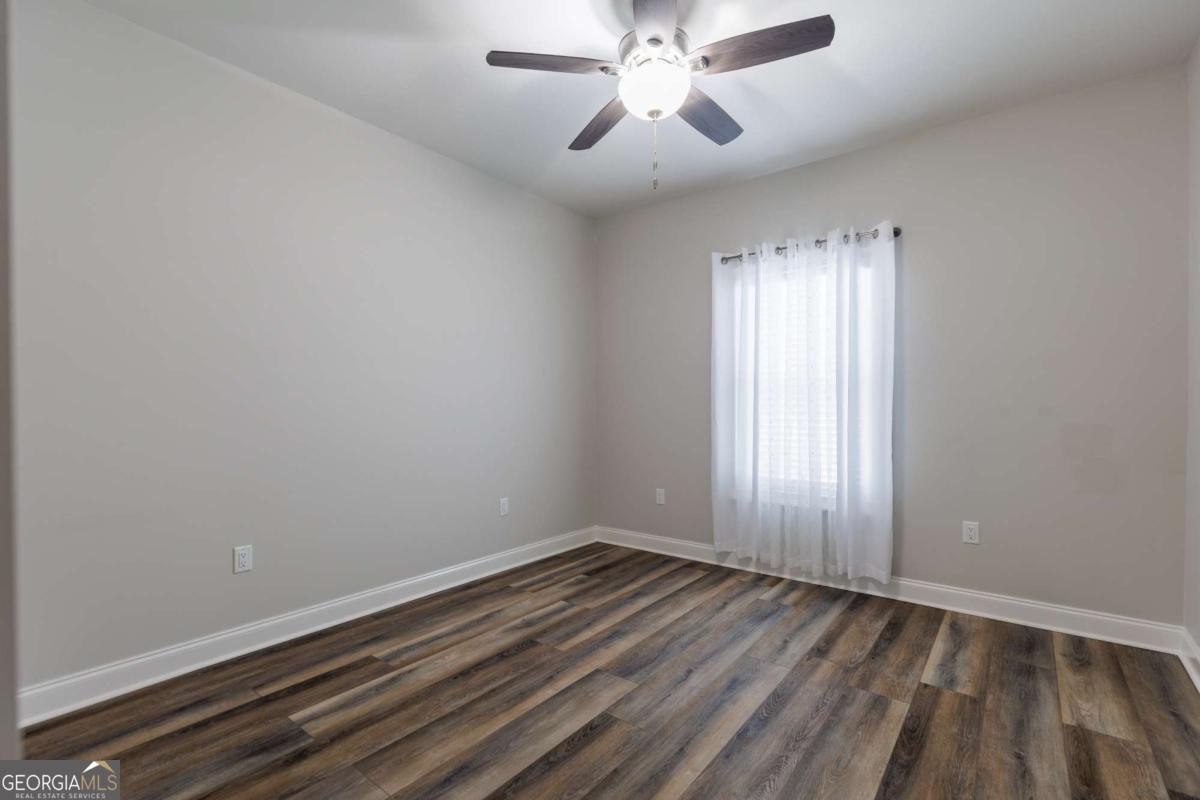 601 Pine Point Circle Valdosta, GA 31602 - Photo 26 of 45 wooden floor in an empty room