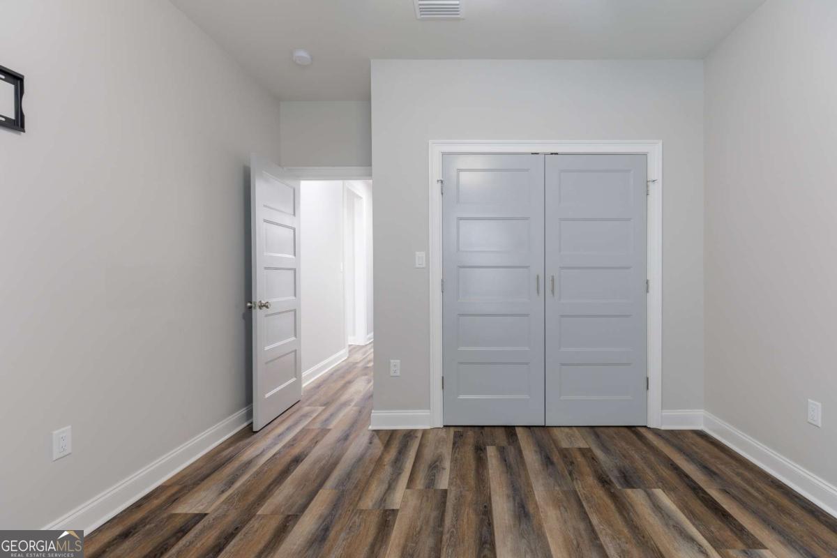 601 Pine Point Circle Valdosta, GA 31602 - Photo 27 of 45 wooden floor in a room