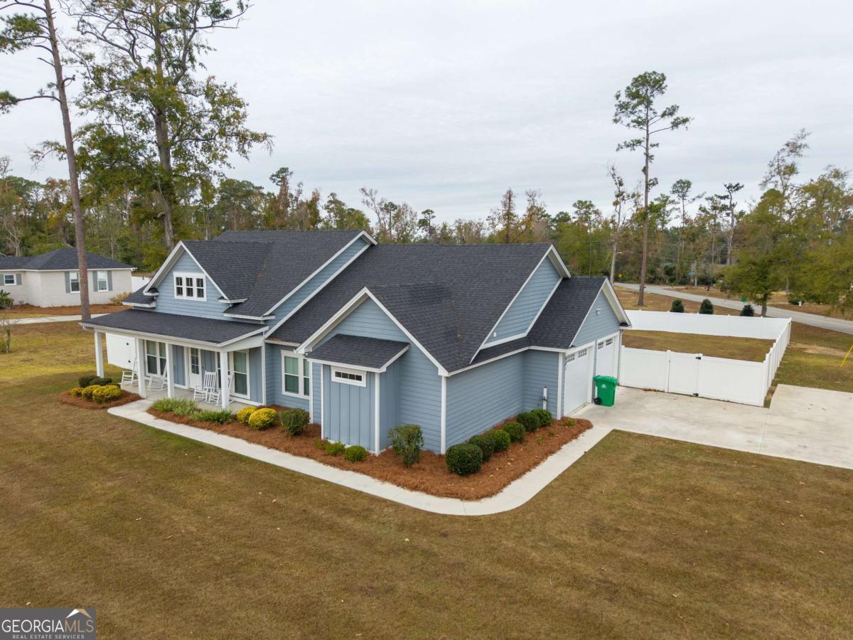 601 Pine Point Circle Valdosta, GA 31602 - Photo 3 of 45 a view of a house with a big yard and large trees