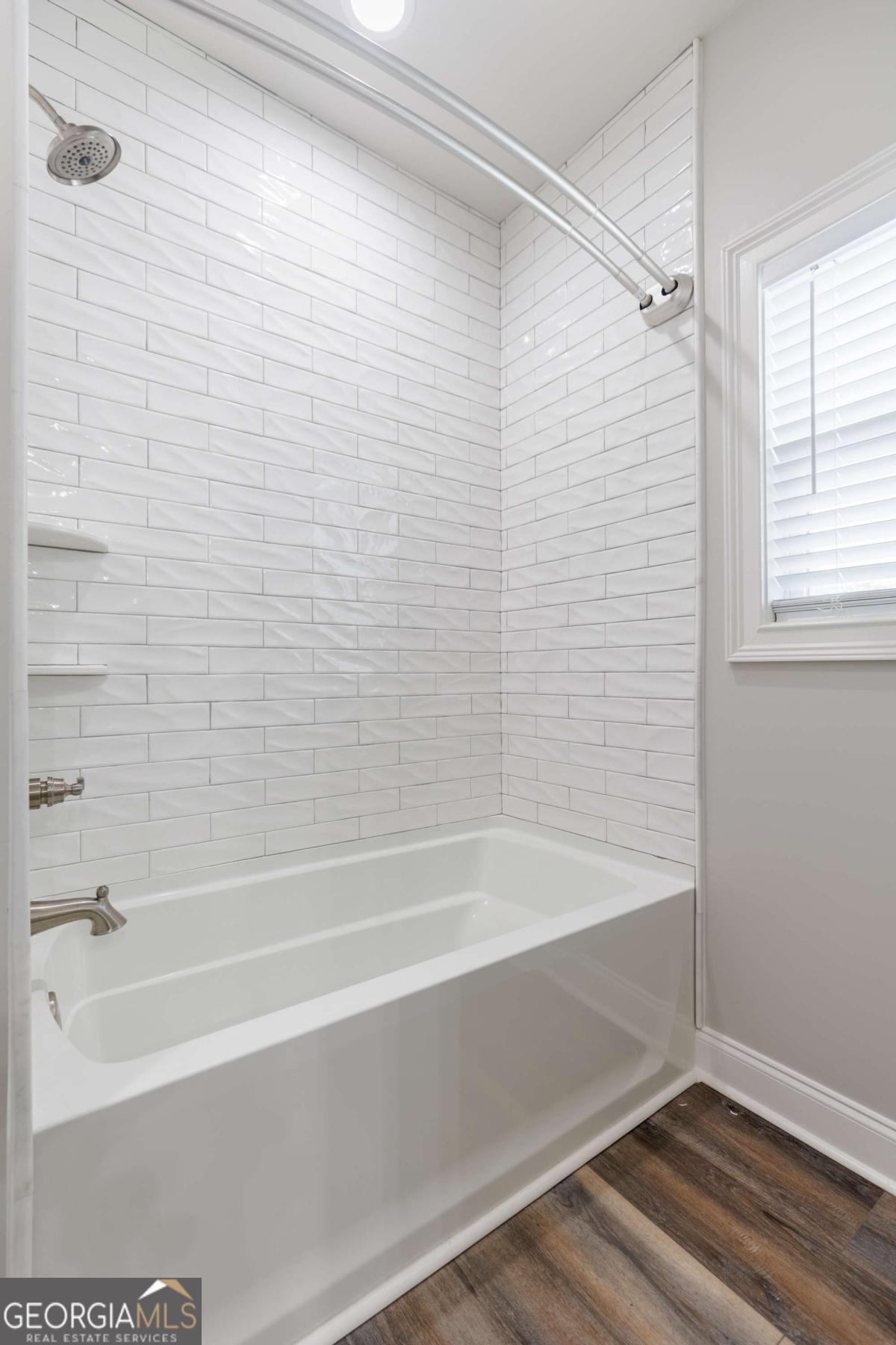 601 Pine Point Circle Valdosta, GA 31602 - Photo 31 of 45 a bathroom with a bathtub and a shower