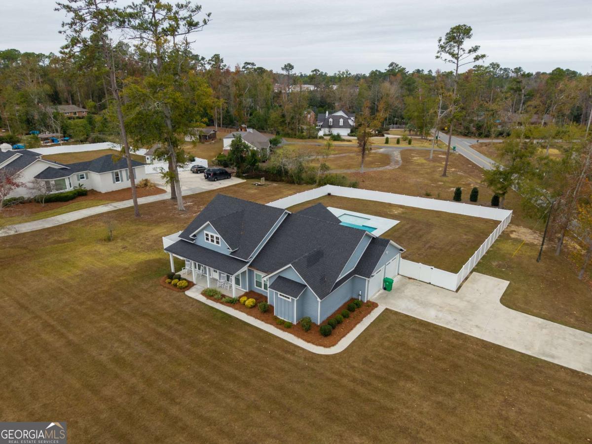 601 Pine Point Circle Valdosta, GA 31602 - Photo 4 of 45 a view of a tennis ground with large trees