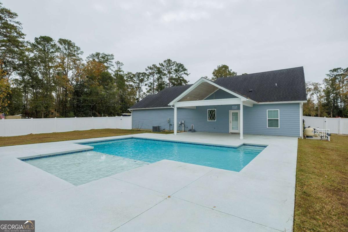 601 Pine Point Circle Valdosta, GA 31602 - Photo 41 of 45 a front view of a house with swimming pool