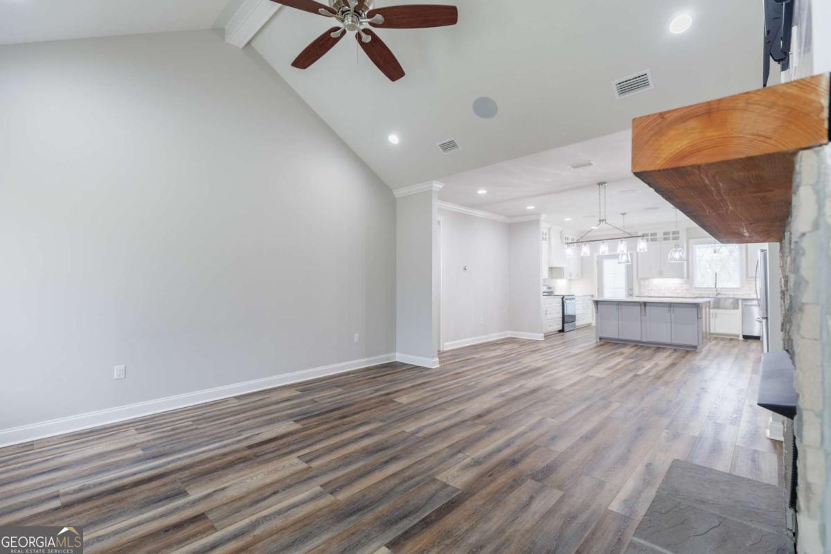 601 Pine Point Circle Valdosta, GA 31602 - Photo 9 of 45 a view of empty room with wooden floor