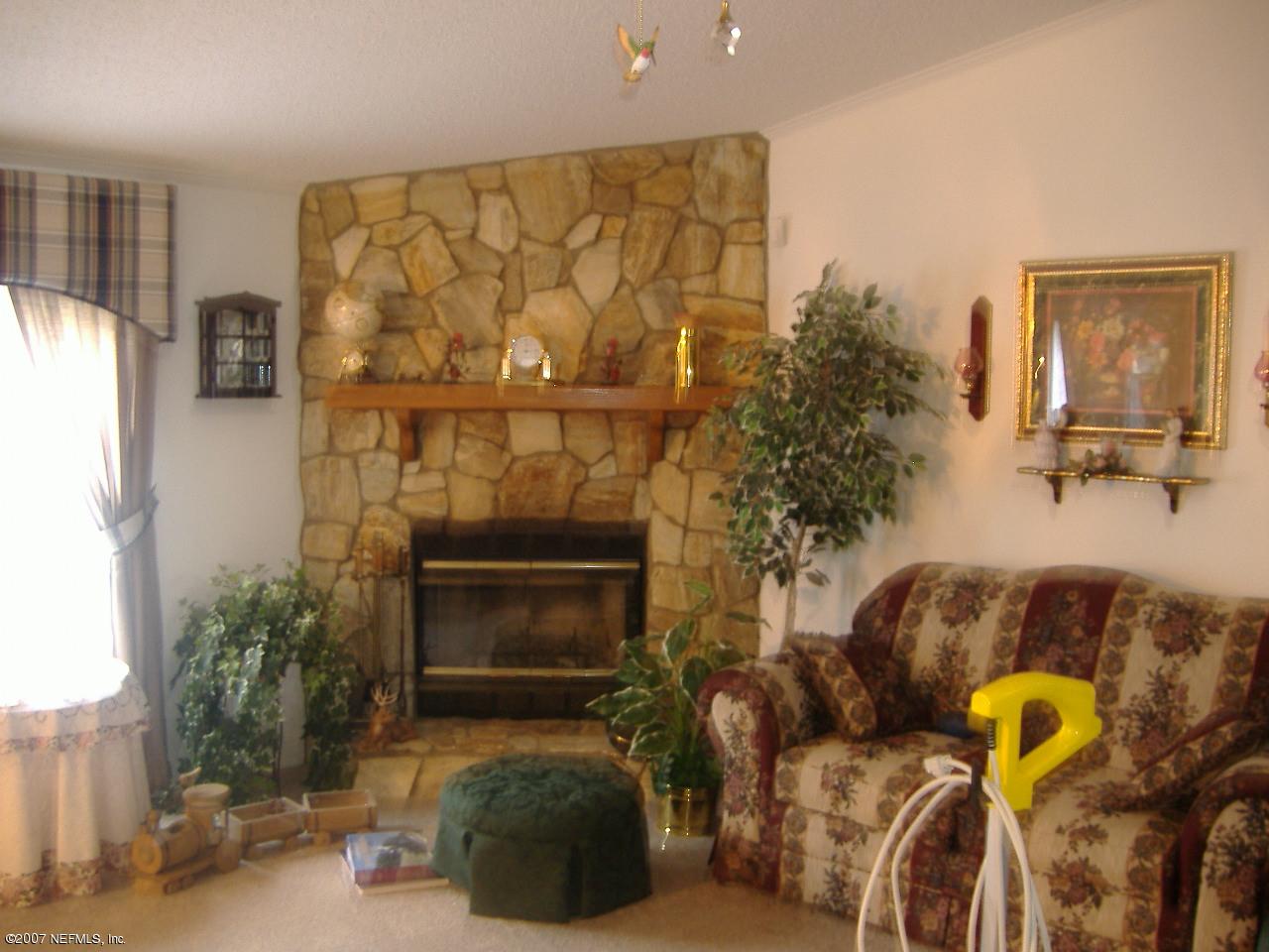 13329 Perdue Road Jacksonville, FL 32218 - Photo 7 of 9 Fireplace in living room