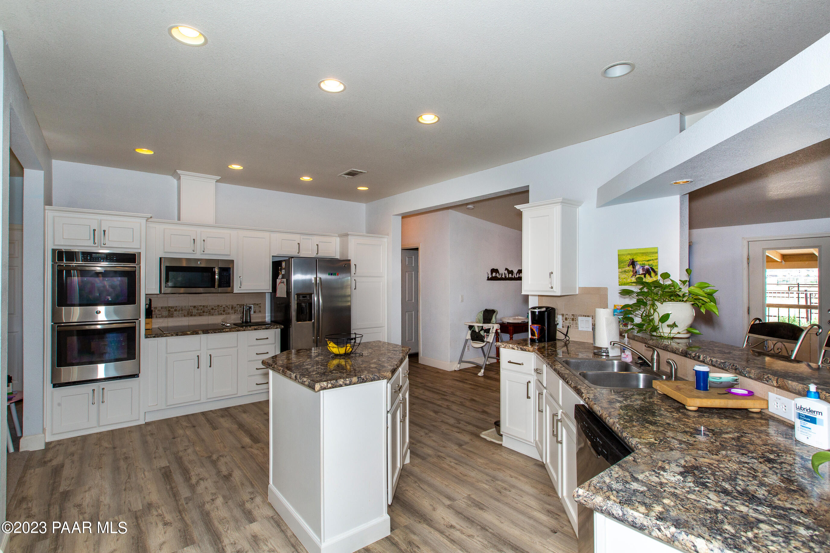 8855 East Turtle Rock Road Prescott Valley, AZ 86315 - Photo 15 of 62 a kitchen with refrigerator and microwave