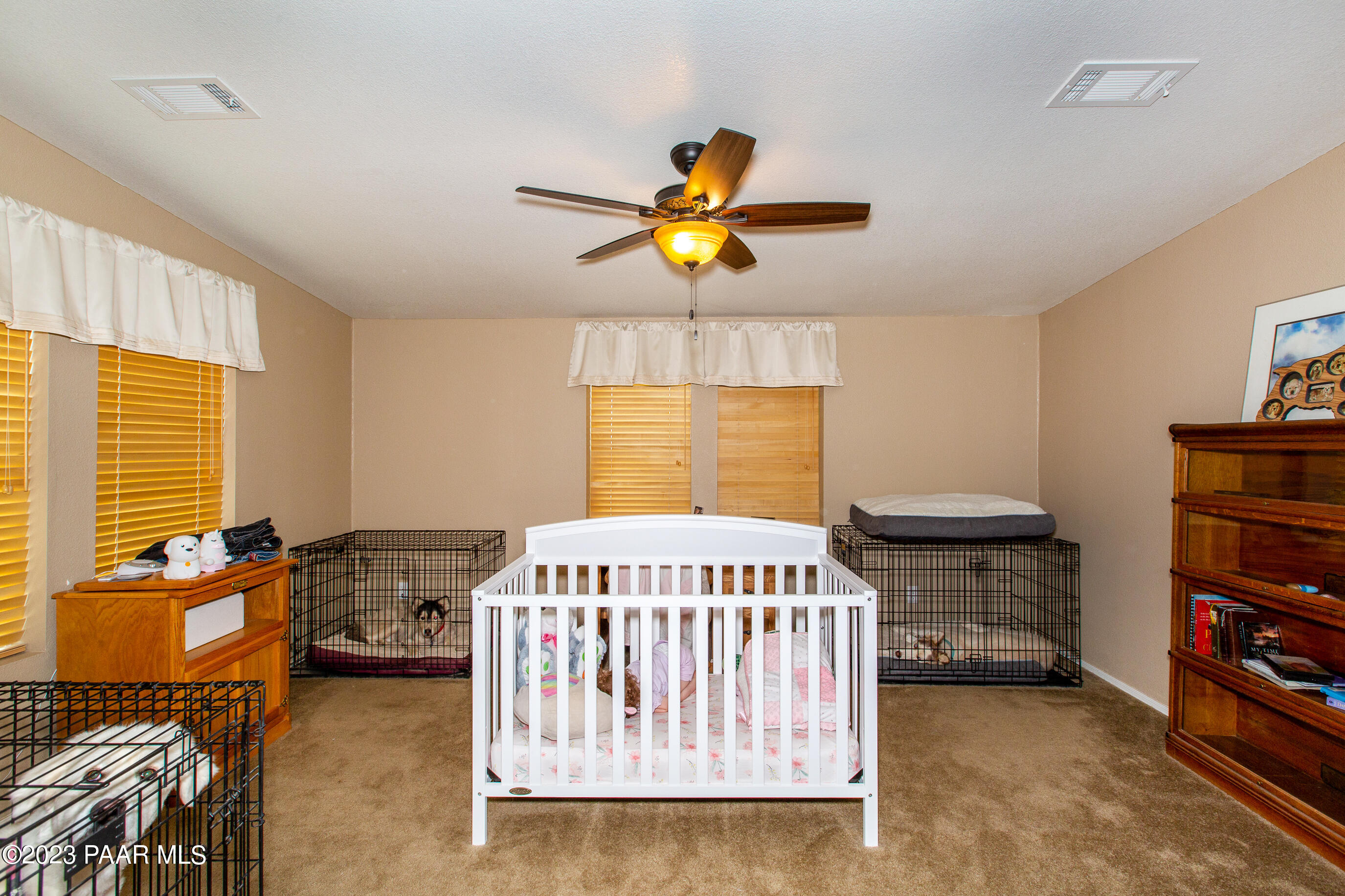 8855 East Turtle Rock Road Prescott Valley, AZ 86315 - Photo 19 of 62 a bedroom with furniture and a window