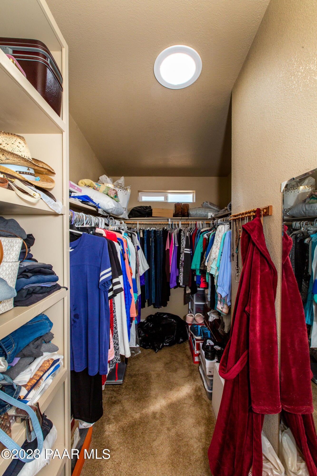 8855 East Turtle Rock Road Prescott Valley, AZ 86315 - Photo 21 of 62 a view of walk in closet with clothes