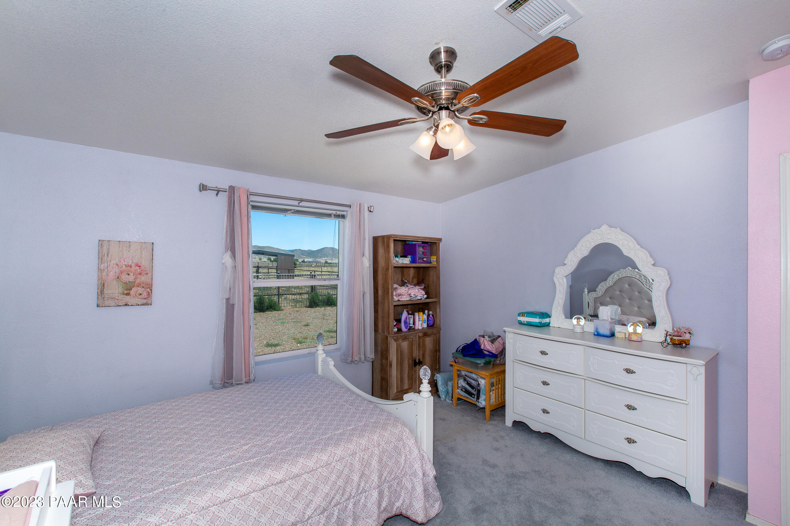 8855 East Turtle Rock Road Prescott Valley, AZ 86315 - Photo 23 of 62 a bedroom with a bed closet and dresser
