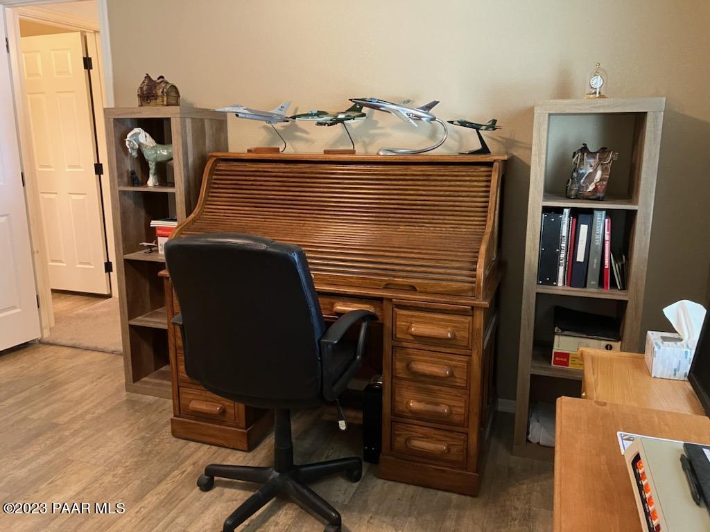 8855 East Turtle Rock Road Prescott Valley, AZ 86315 - Photo 26 of 62 a view of a workspace with furniture and a window