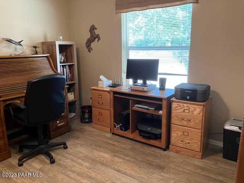8855 East Turtle Rock Road Prescott Valley, AZ 86315 - Photo 27 of 62 a view of a workspace with furniture and a window