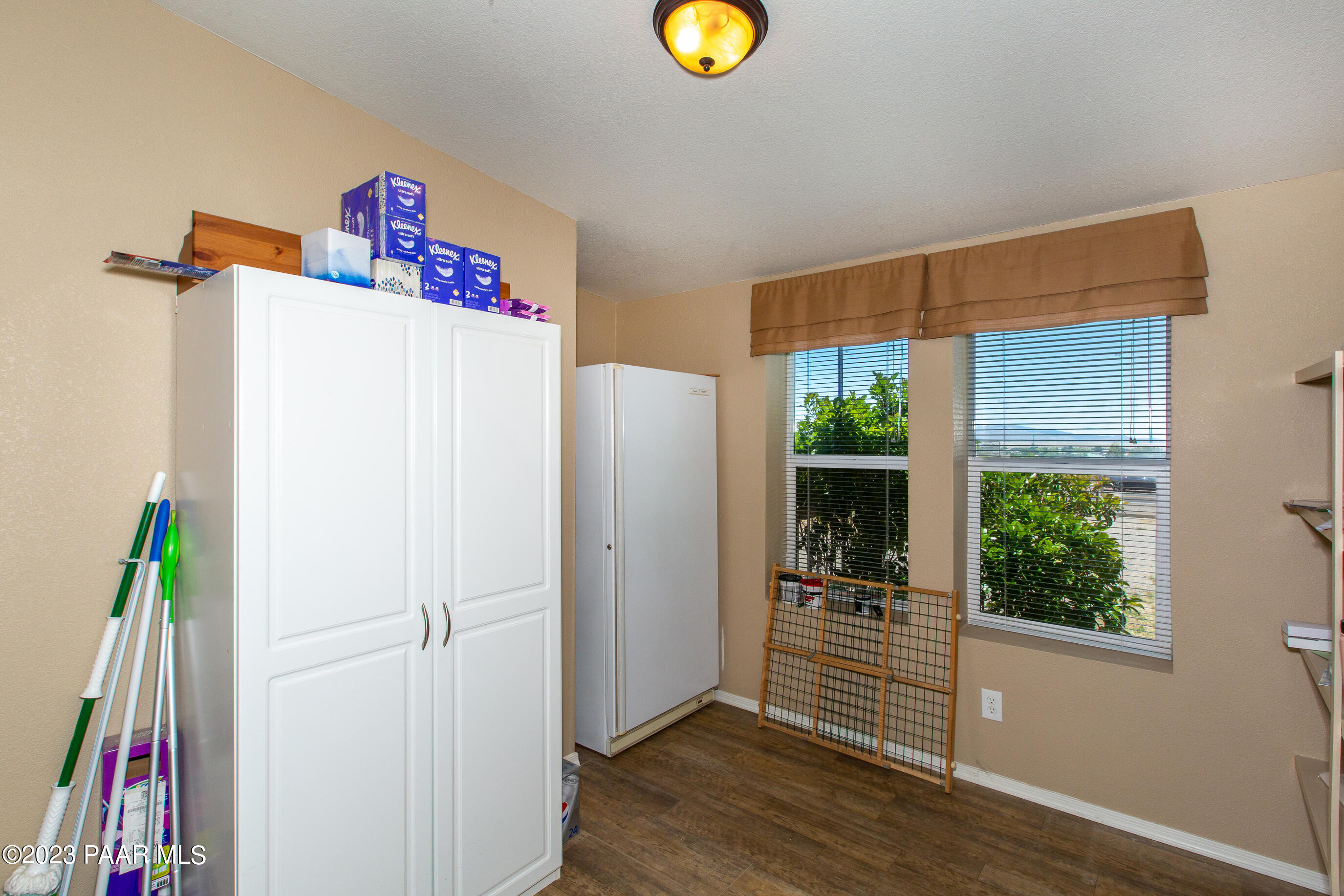 8855 East Turtle Rock Road Prescott Valley, AZ 86315 - Photo 33 of 62 a view of a hallway with wooden floor and a window