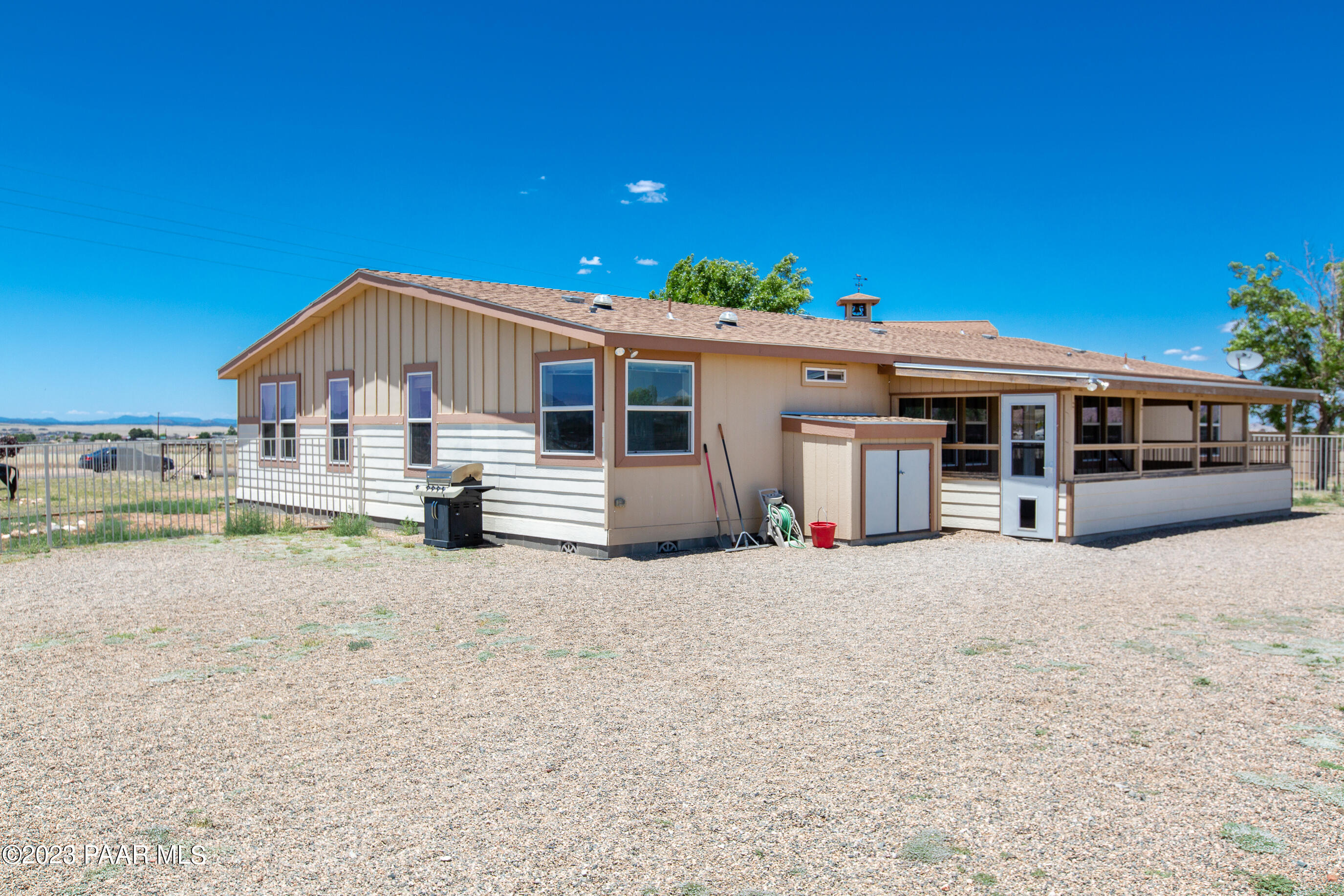 8855 East Turtle Rock Road Prescott Valley, AZ 86315 - Photo 35 of 62 a front view of a house with a yard