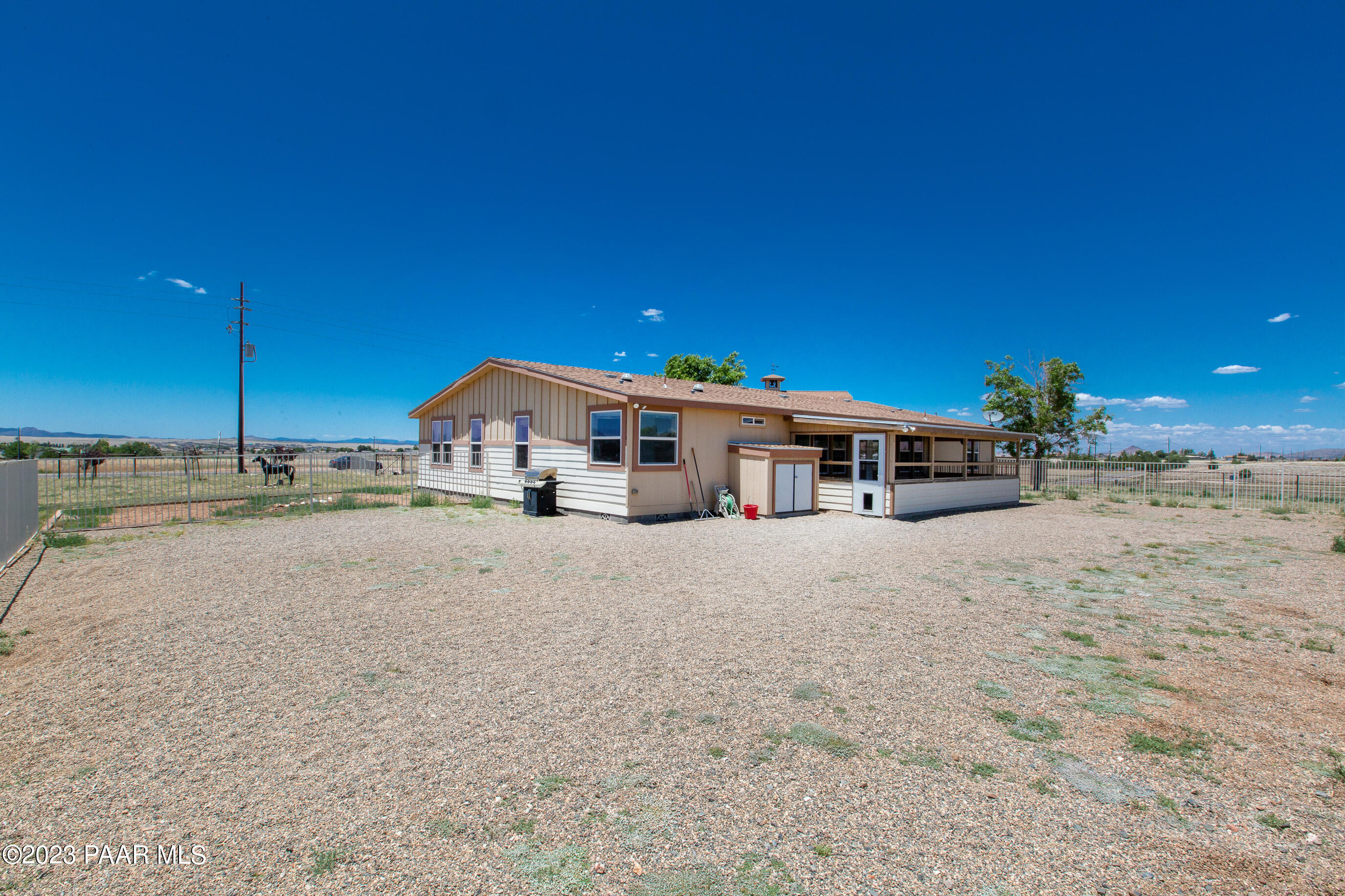 8855 East Turtle Rock Road Prescott Valley, AZ 86315 - Photo 36 of 62 a front view of a house with a yard
