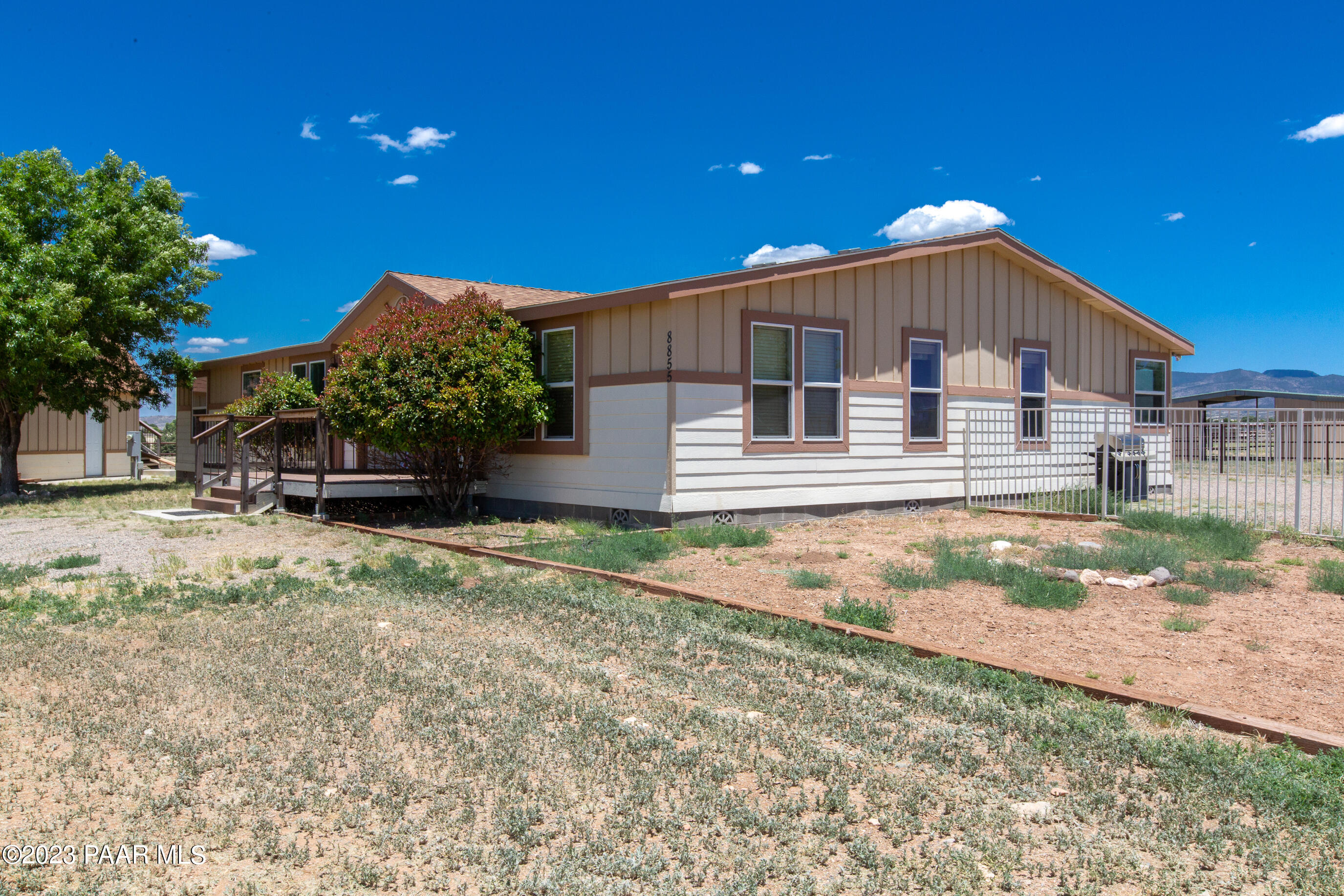 8855 East Turtle Rock Road Prescott Valley, AZ 86315 - Photo 42 of 62 a front view of a house with a yard