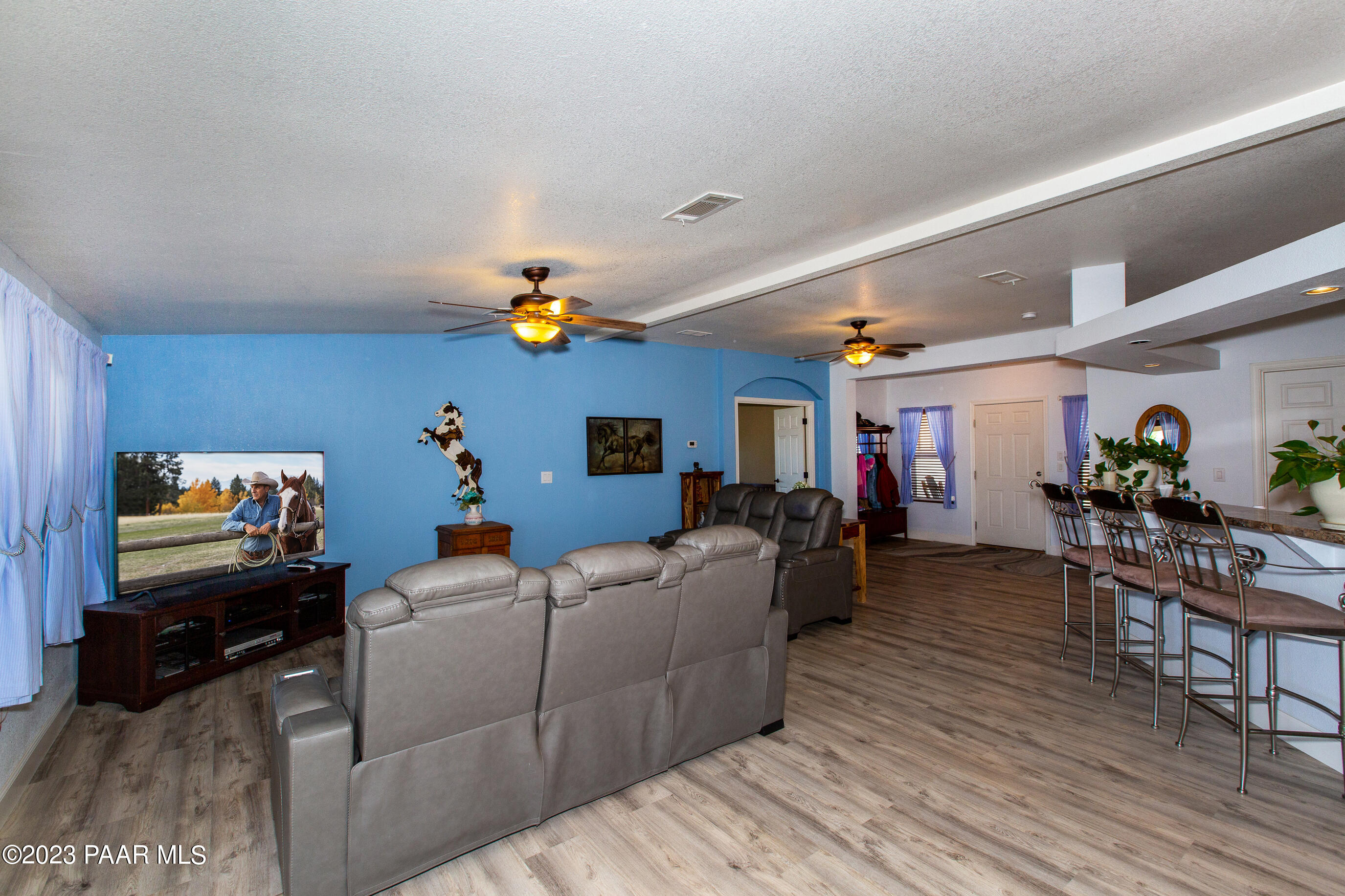 8855 East Turtle Rock Road Prescott Valley, AZ 86315 - Photo 10 of 62 a living room with furniture and a flat screen tv