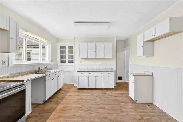 a large kitchen with a stove top oven