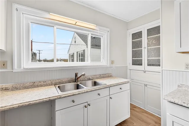 a kitchen with a sink and cabinets