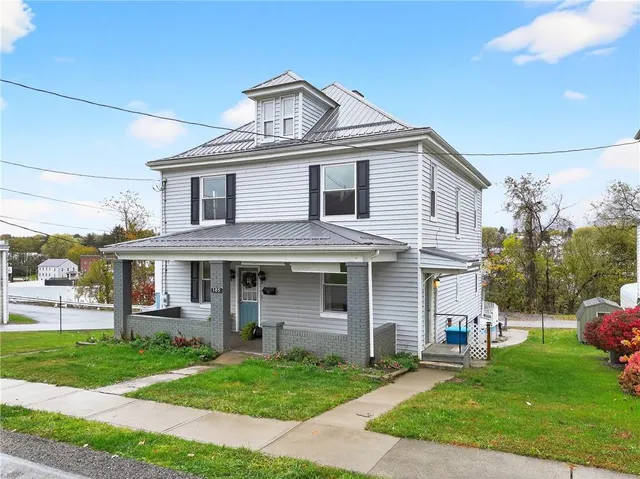 a front view of a house with a yard