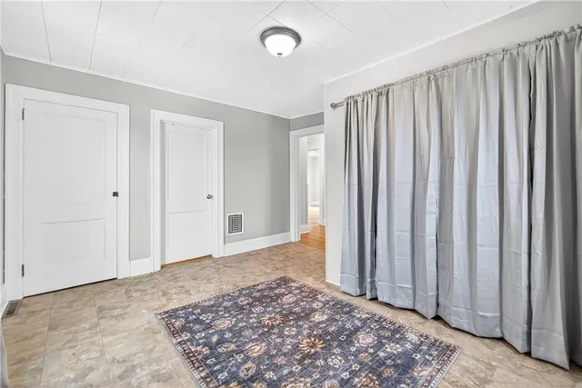 a view of a livingroom with wooden floor
