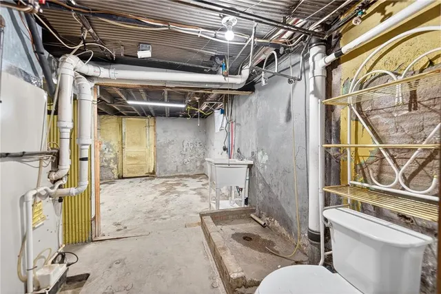 an aerial view of residential houses with outdoor space and swimming pool