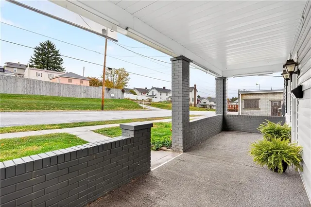 a view of an outdoor kitchen and a fountain