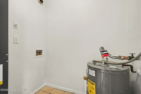 a room with a sink and mirror