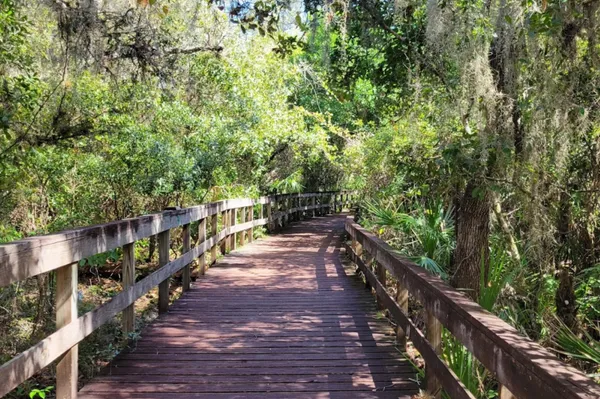a view of a balcony with wooden stairs