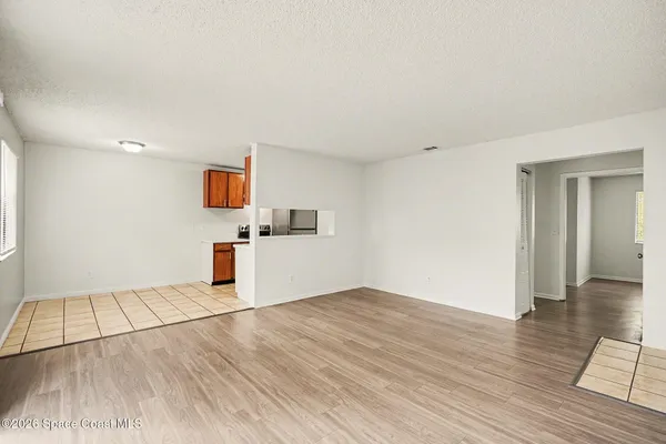 a view of a livingroom with wooden floor