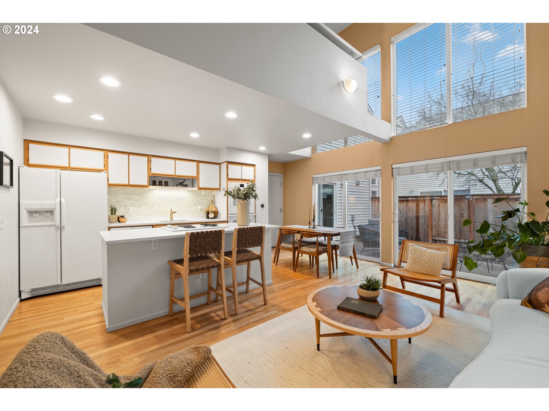 14525 Southwest 6th Street Beaverton, OR 97007 - Photo 2 of 14 a living room with stainless steel appliances kitchen island granite countertop furniture and a kitchen view