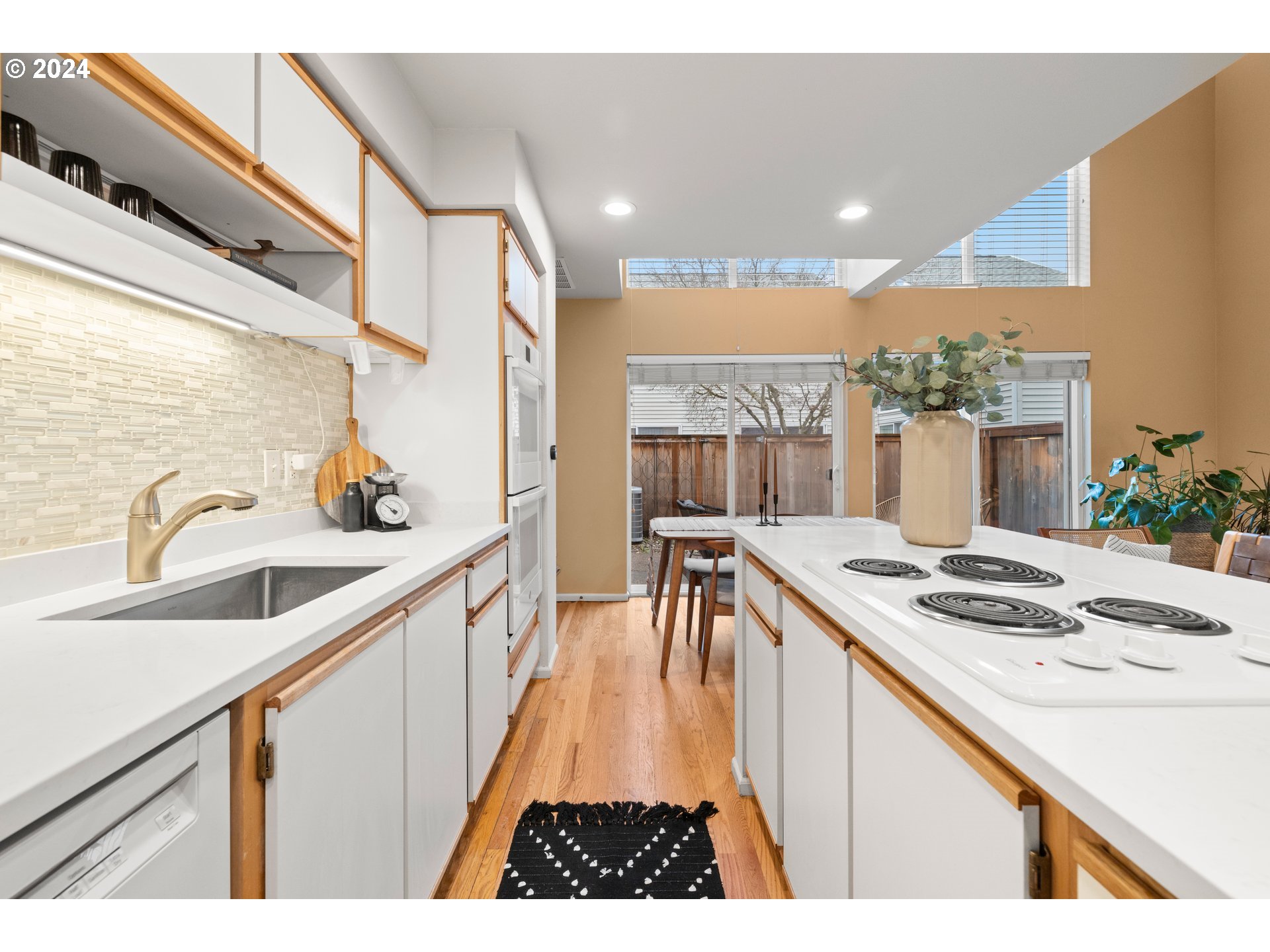 14525 Southwest 6th Street Beaverton, OR 97007 - Photo 3 of 14 a kitchen with stainless steel appliances granite countertop a sink stove and cabinets