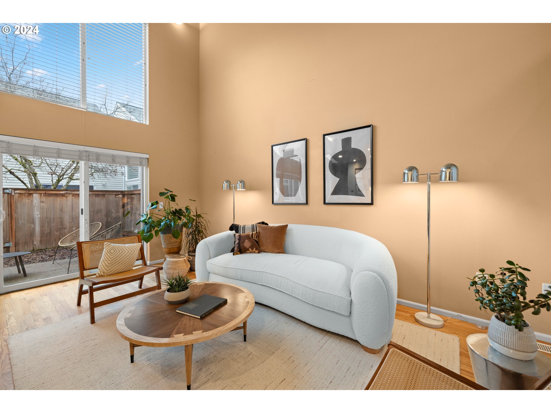 14525 Southwest 6th Street Beaverton, OR 97007 - Photo 4 of 14 a living room with furniture and a potted plant