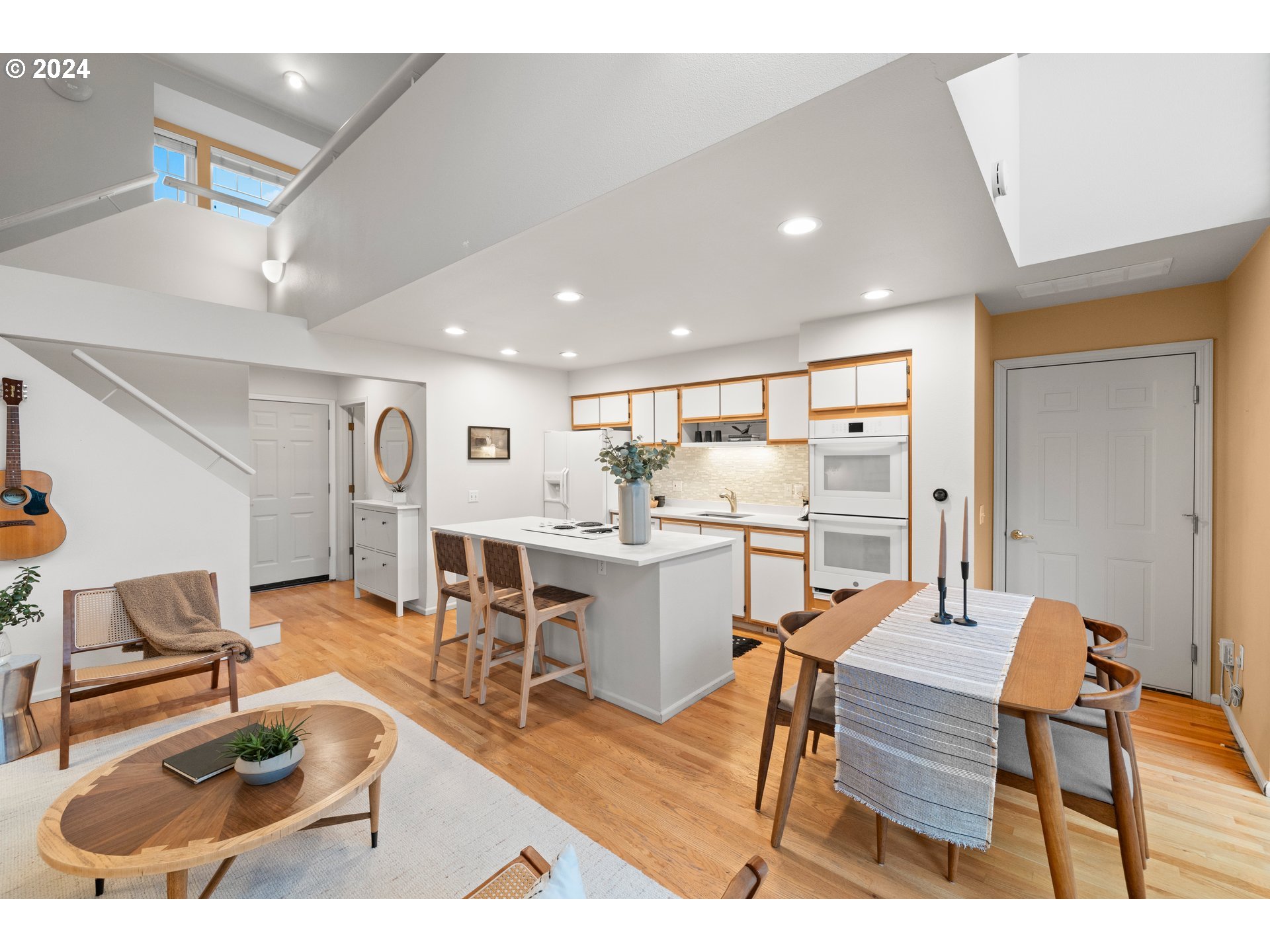 14525 Southwest 6th Street Beaverton, OR 97007 - Photo 5 of 14 a living room with furniture and kitchen view