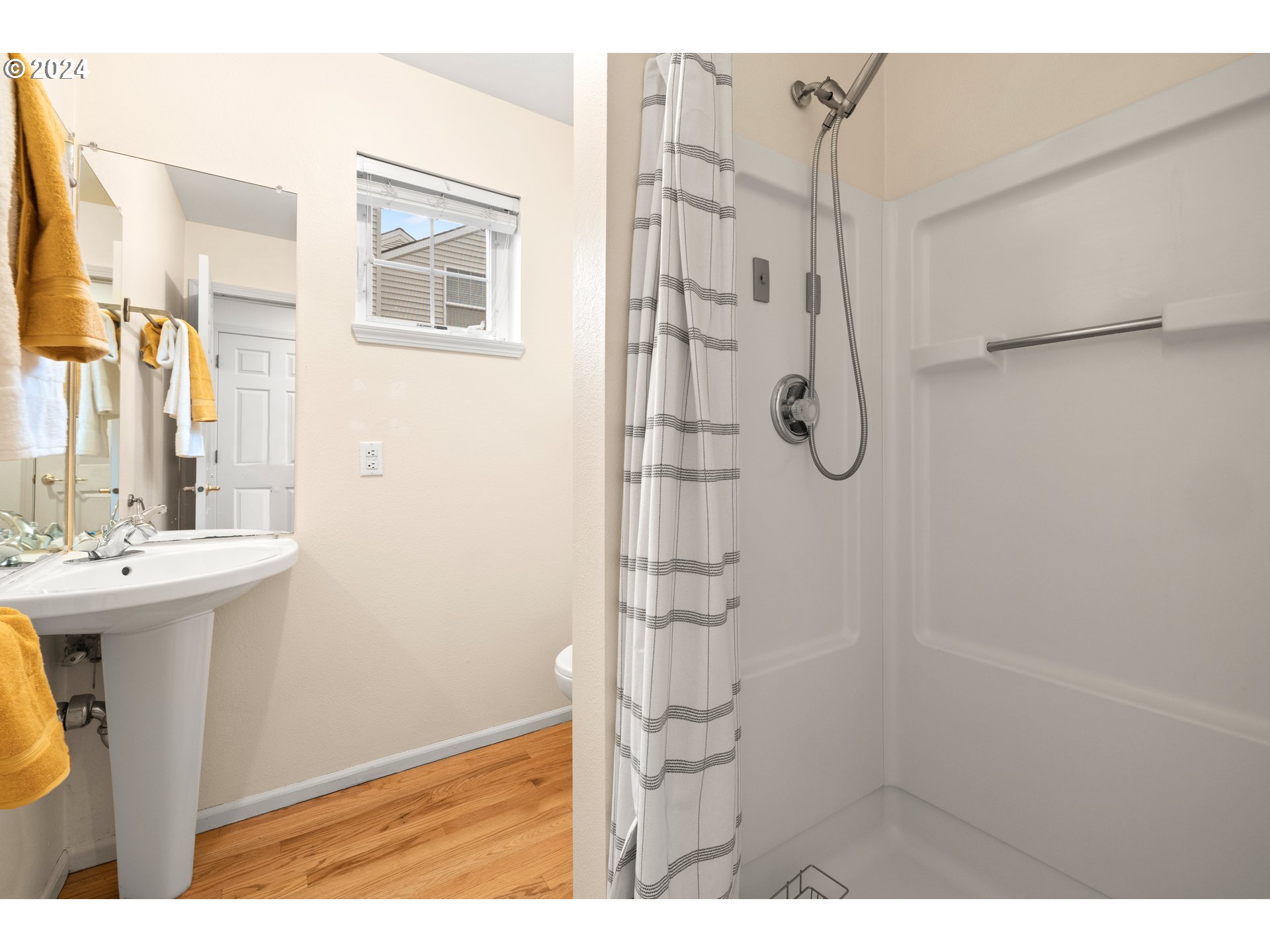 14525 Southwest 6th Street Beaverton, OR 97007 - Photo 6 of 14 a bathroom with a shower and a sink