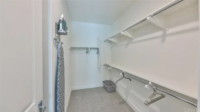 a room that has a bed and a dresser in it